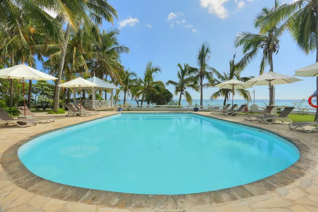 Cocotiers Hotel Rodrigues with outdoor pool, beach loungers, and ocean view